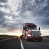 3/4 front view of a  commercial truck on the road at sunset  in eastern Washington, USA
